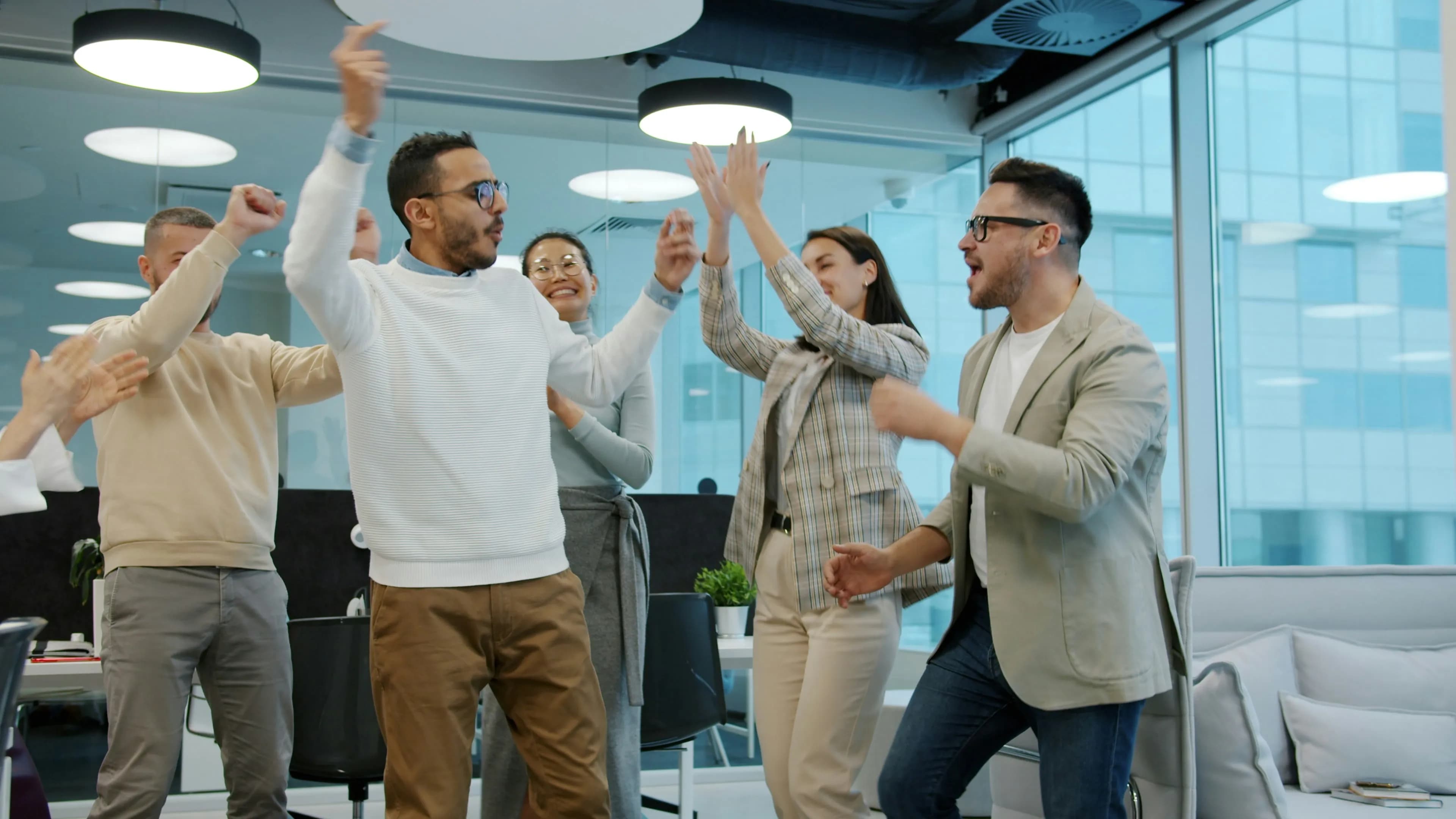 Team members discussing work in an open studio