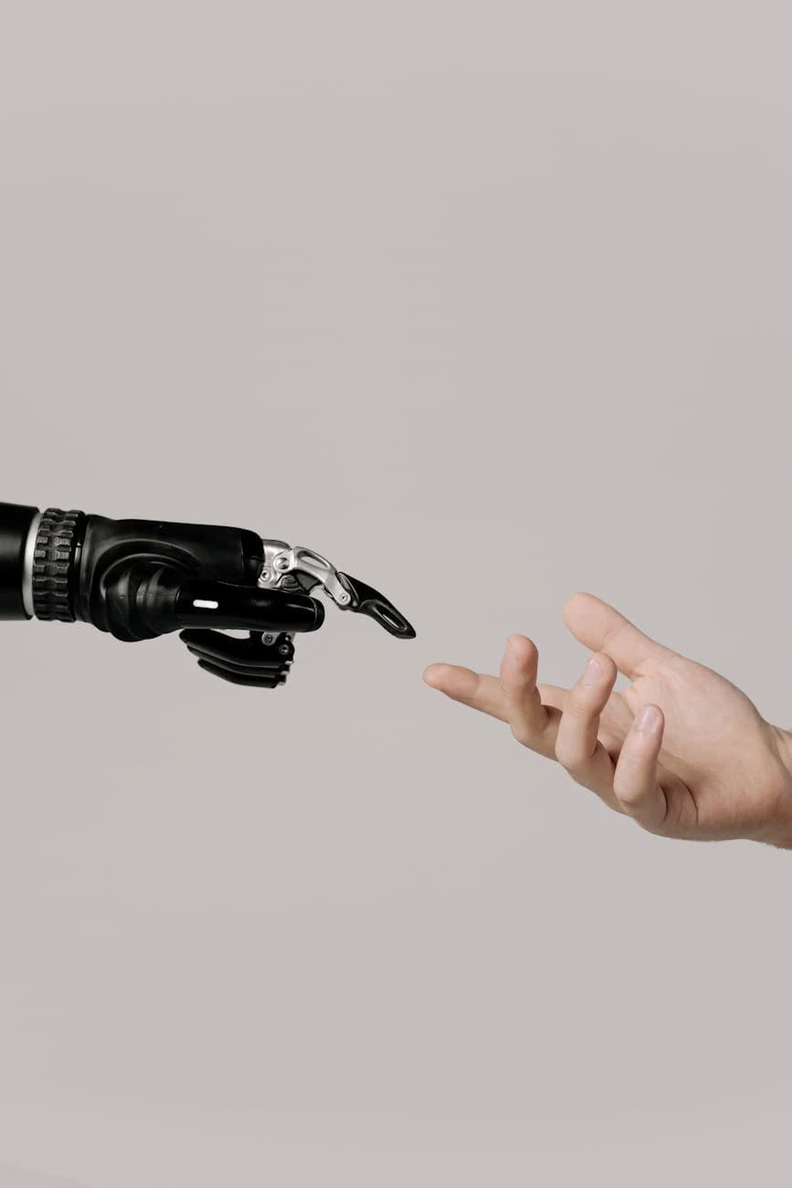 Robot and human hand representing technological innovation