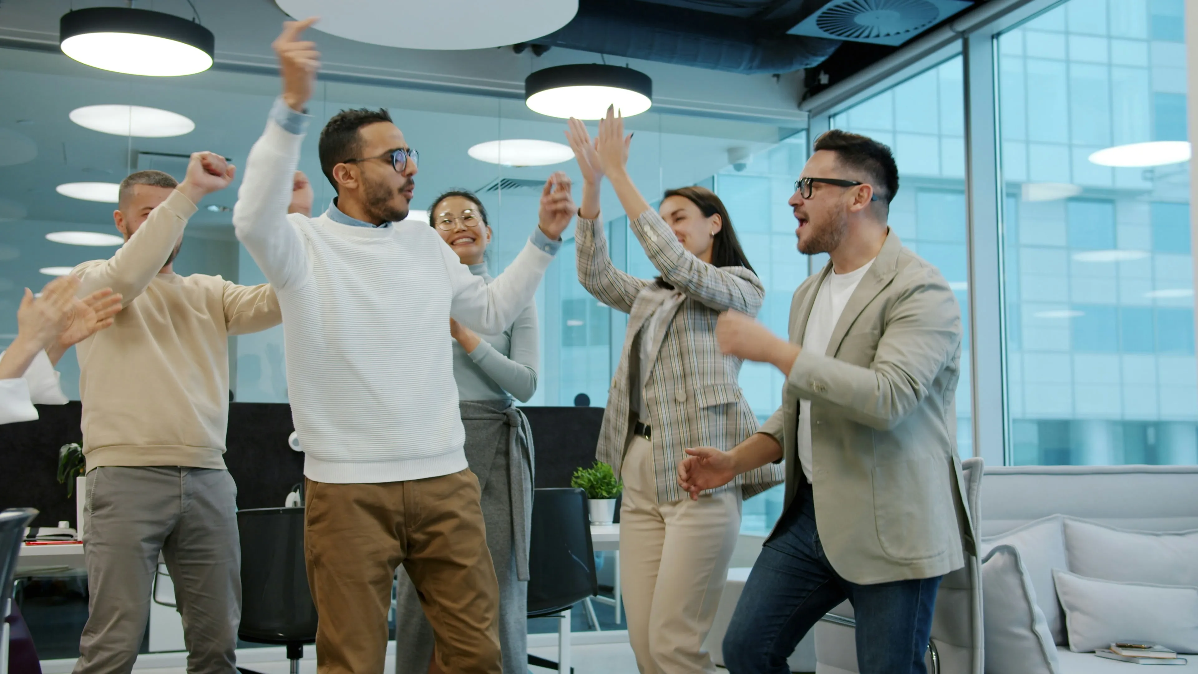 Team members discussing work in an open studio